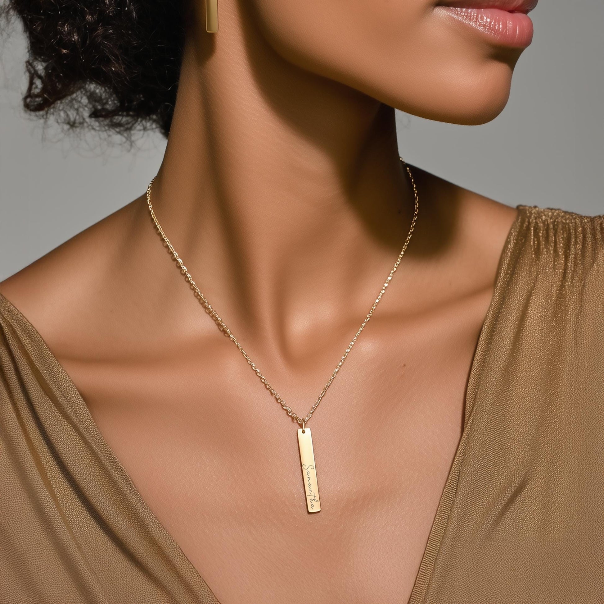 Elegant gold bar necklace on model – minimalist vertical bar pendant jewelry with matching earrings, modern personalized necklace gift for her.
