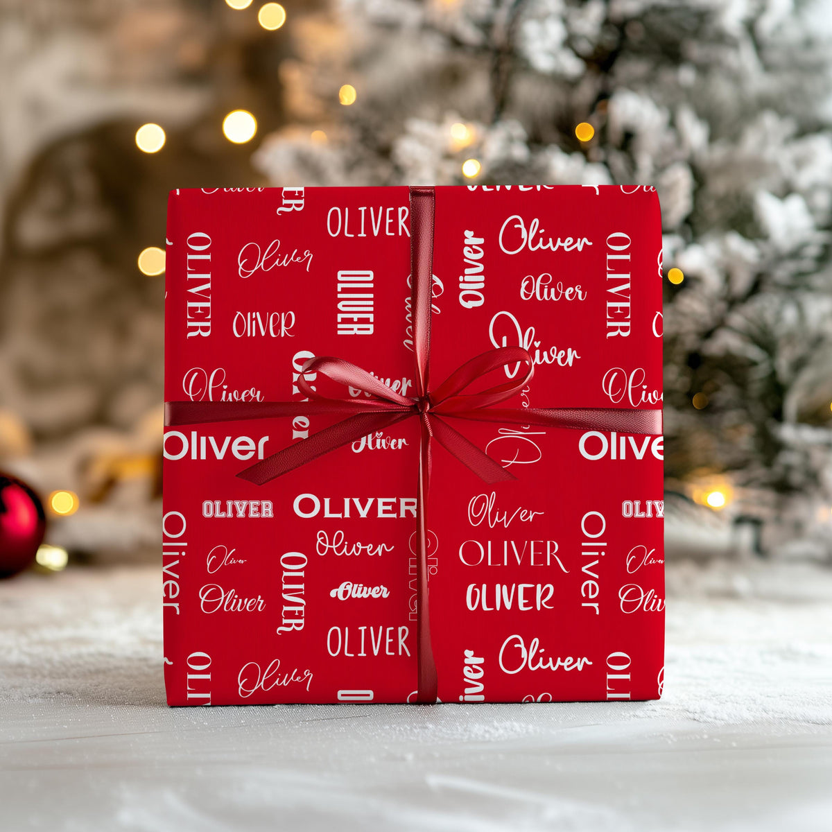 Personalized name Christmas wrapping paper – custom red gift wrap featuring repeating name design in festive fonts. Unique holiday gift wrap for Christmas presents, birthdays, and special occasions.