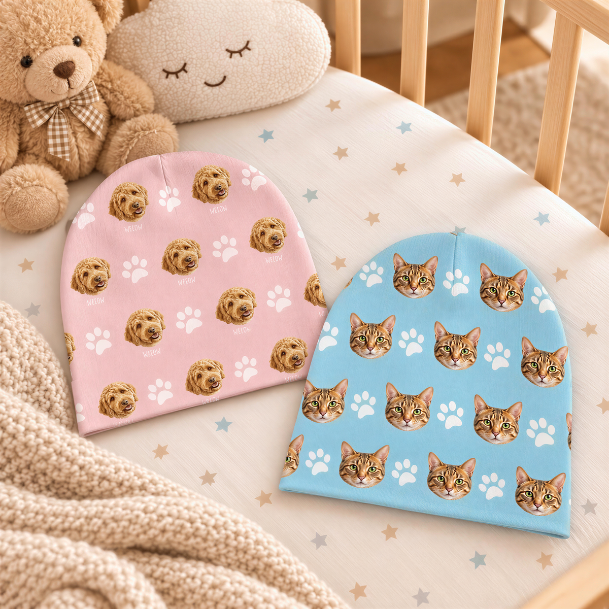 A baby's crib with two colorful beanie hats on it, featuring images of dogs and cats. A teddy bear is also present in the scene.