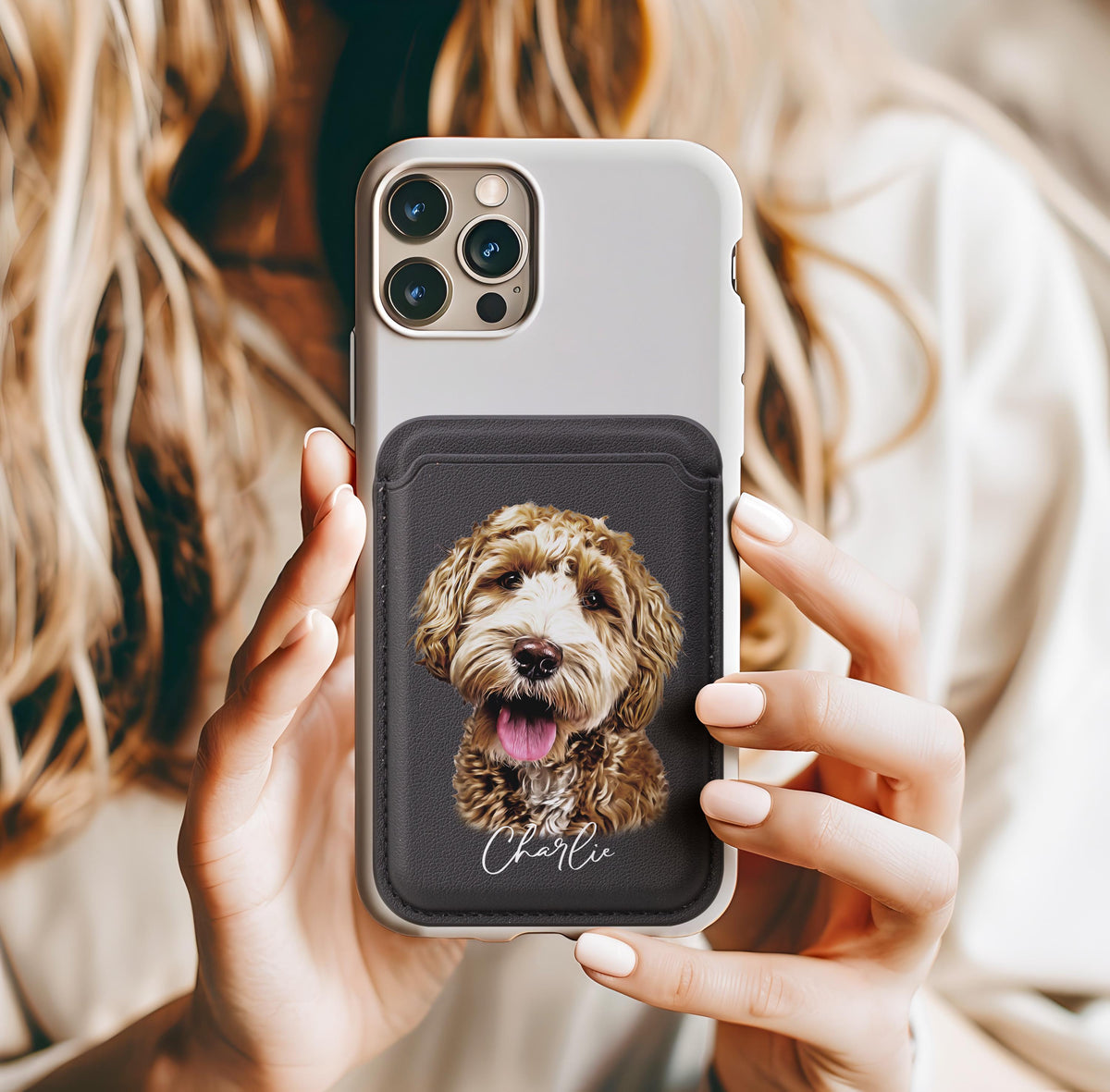 Woman holding custom pet phone wallet case attached to iPhone, black card holder featuring personalized watercolor dog portrait and name Charlie, cute doodle dog design on minimalist white phone case