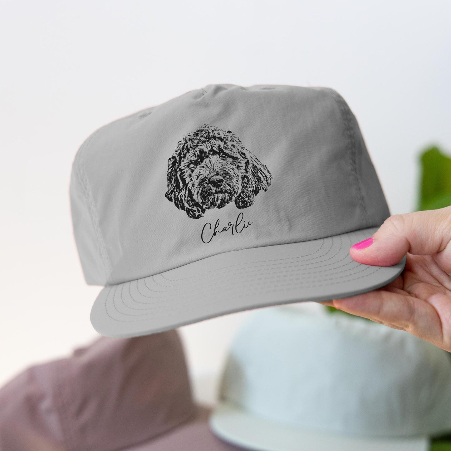 Custom pet portrait hat featuring your furry friend's adorable face! Perfect for pet lovers, this stylish and personalized surf cap makes a unique gift for dog moms, dads, and sports fans. Celebrate your pet in a fun and fashionable way!
