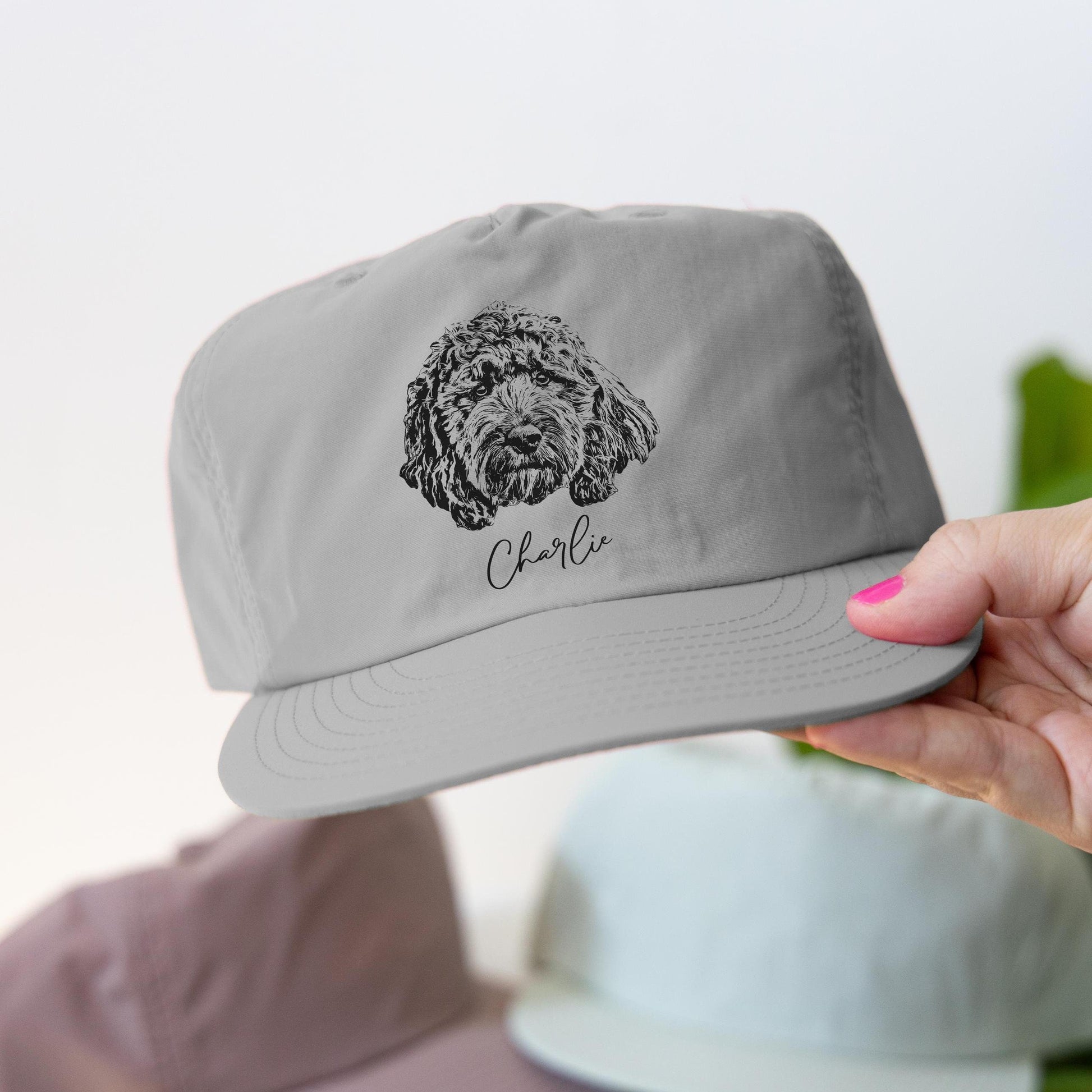 Custom pet portrait hat featuring your furry friend's adorable face! Perfect for pet lovers, this stylish and personalized surf cap makes a unique gift for dog moms, dads, and sports fans. Celebrate your pet in a fun and fashionable way!